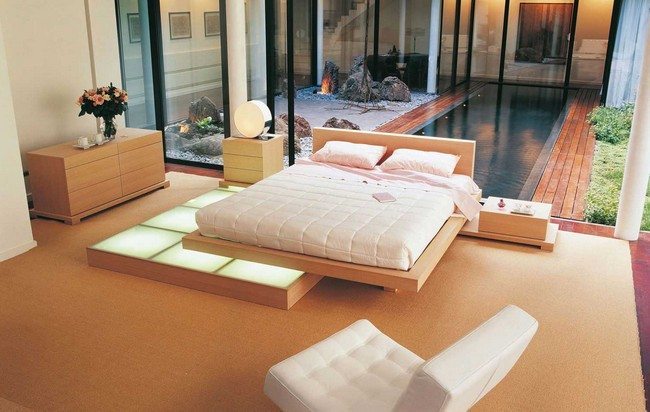 double bed in the light colors with softa armchair