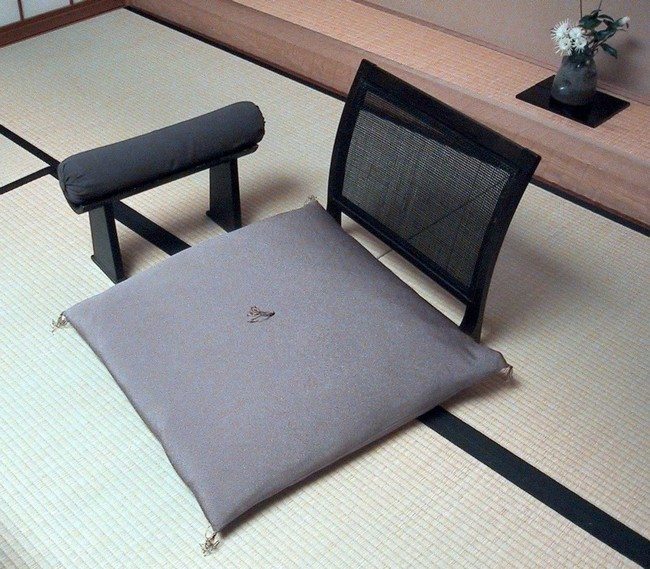 modern japanese hi tec armchair of grey color with armrest