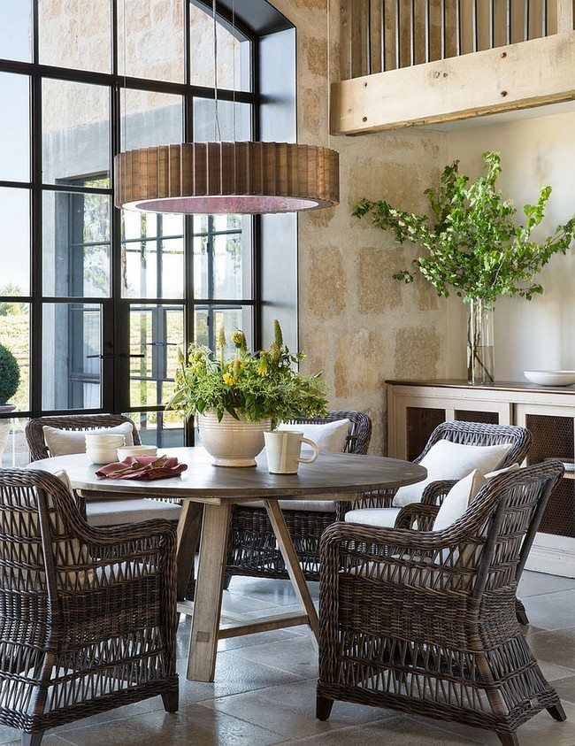 chairs made from stroke and green flowers in the kitchen with french windows