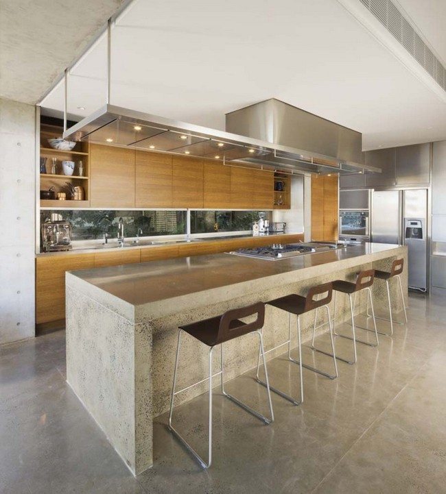 concrete-flooring-with-cosy-straight-kitchen-island-table-design-ideas-plus-modern-stools-and-oversized-range-hood