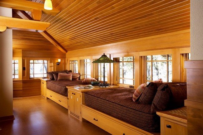 2 single beds under the roof on the attic made from pine
