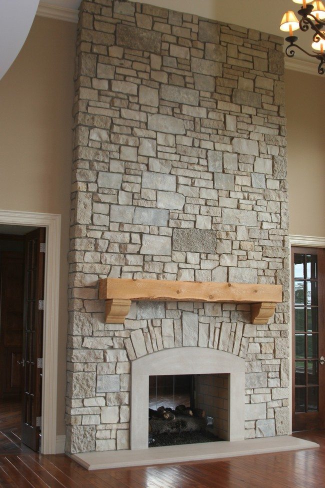 light brick rock fireplace between 2 wooden doors