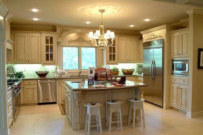 interior-cream-wooden-kitchen-island-with-brown-counter-top-and-white-wooden-stools-plus-white-wooden-cabinet-on-the-cream-floor with metal fridge