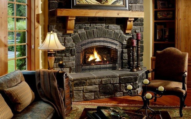 black stone corner fireplace with 2 chairs and one lamp giving bright light