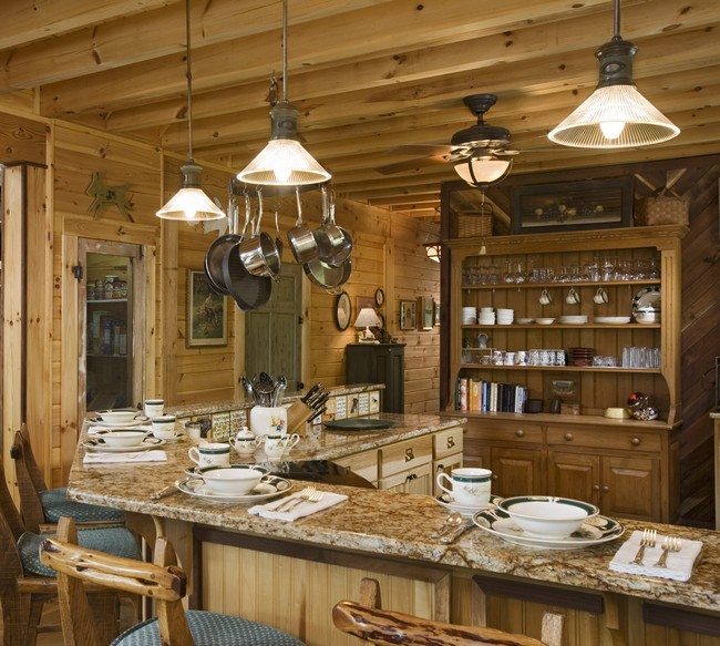 kitchen with wooden beamc on the ceiling, wooden cabinet and table od the dark colour