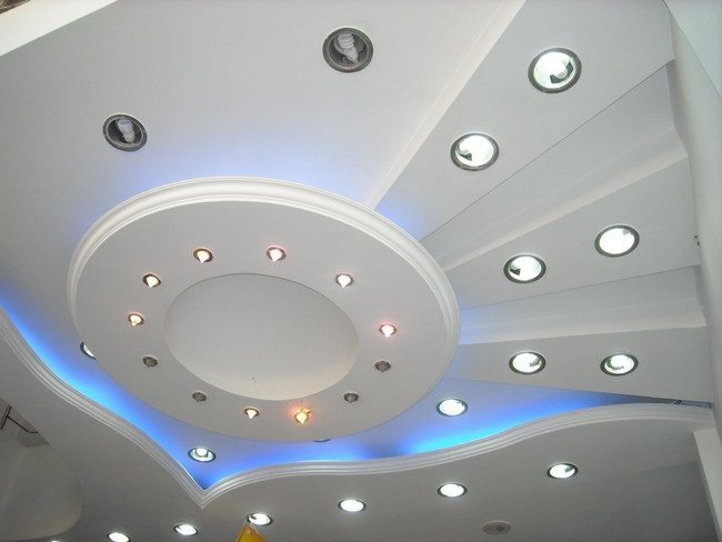 white round ceiling from plastic board with small round lights