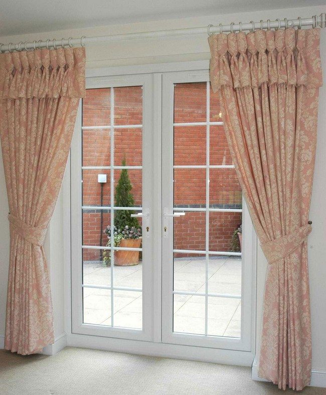 french door to the backyard with light curtains holding by ropes
