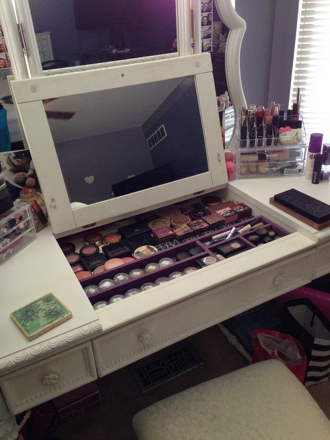 mirrored makeup storage for with two mirrors on the white wooden table