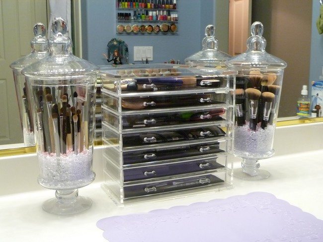 clear glass mirrored makeup storage full of cosmetics
