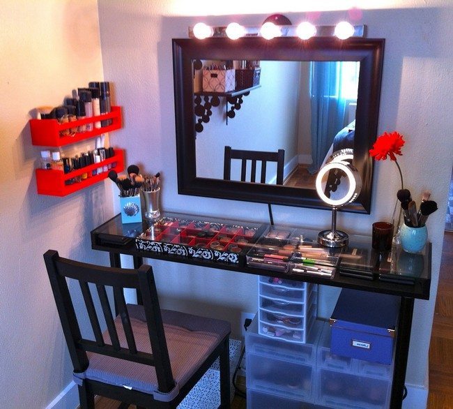 mirrored makeup table made drom wood with surface from glass with cosmetics under it