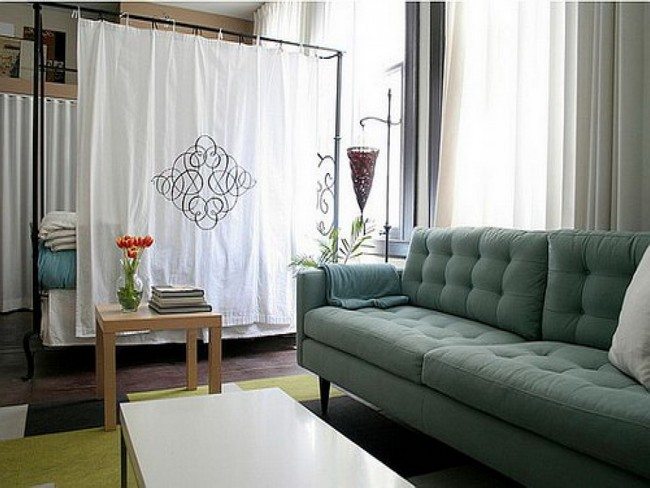 white curtain as a divider itne h room with green sofa