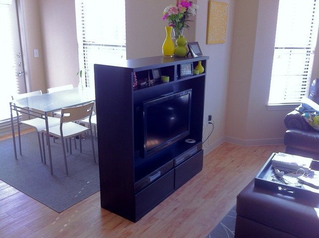 tv stand an a tv as a room divider from dining room