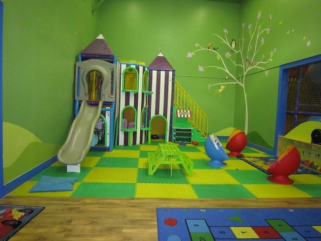Green themed room with playhouse