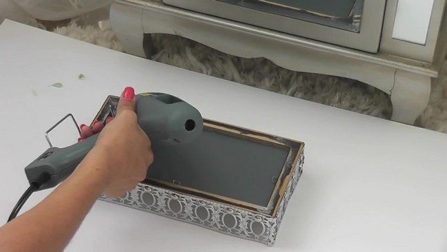 Placing the mirror into the frame