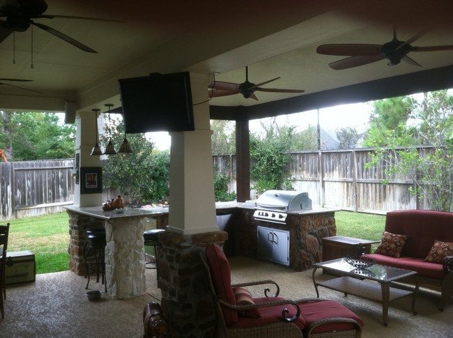 Large bar with cabinets and barbecue grill