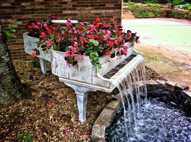 Piano with bright flowers used to create waterfall