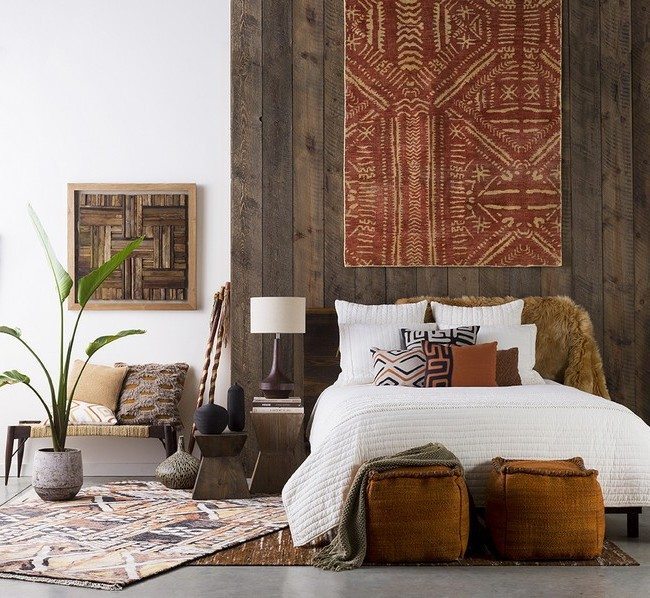 Simple patterned rug hung on wooden wall