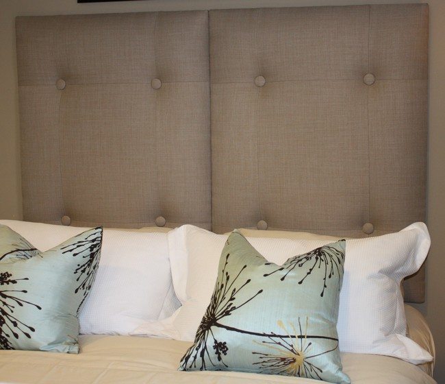Neutral-colored tufted headboard