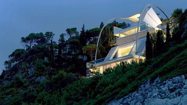 White, futuristic house with two balconies
