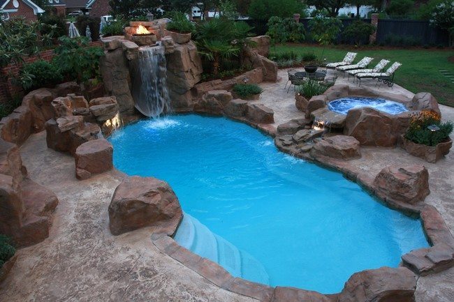 Pool waterfall with burning fire pit