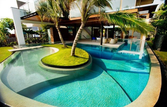 Large contemporary pool with garden in the middle