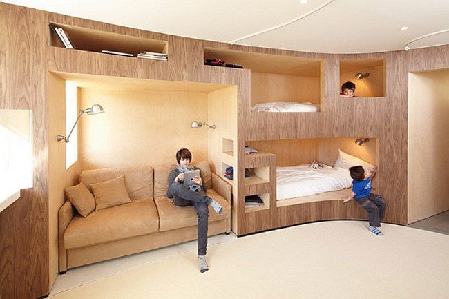 Innovative wooden wall with several bunk beds 