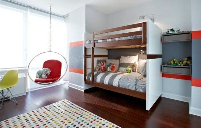 Trendy kids’ room with a bubble chair and bunk beds 