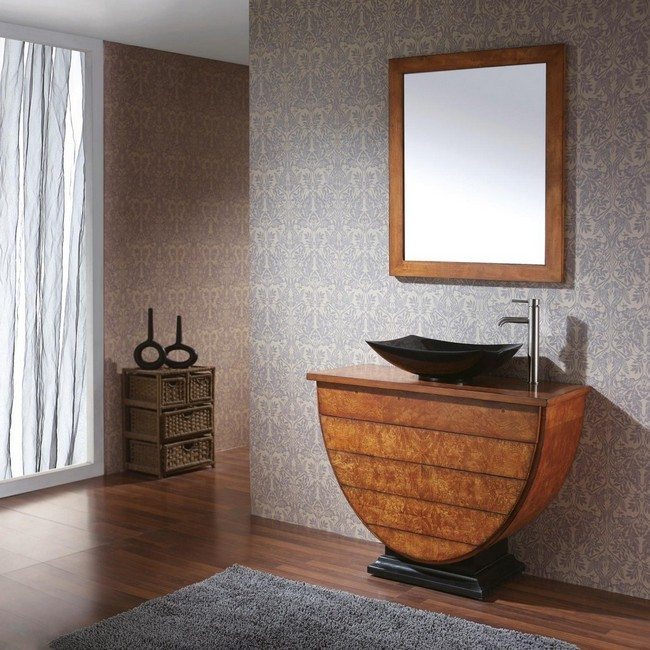 Black stand-alone sink on top of wooden vanity