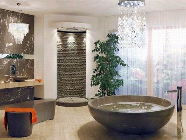 Contemporary glass chandelier hanging over the bathtub