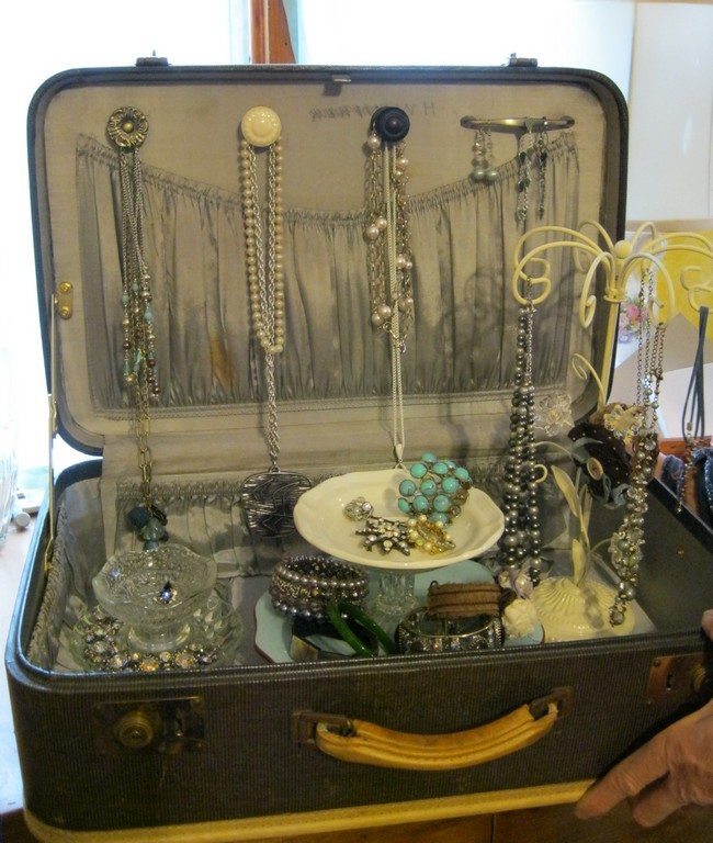 Old suitcase used for jewelry storage