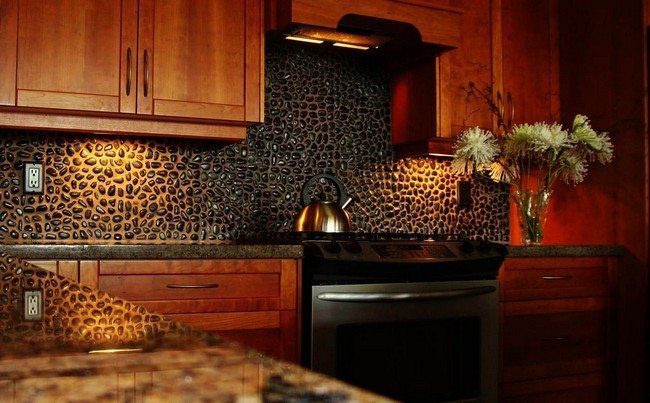 Medium-tone wooden cabinets against dark stone backsplash