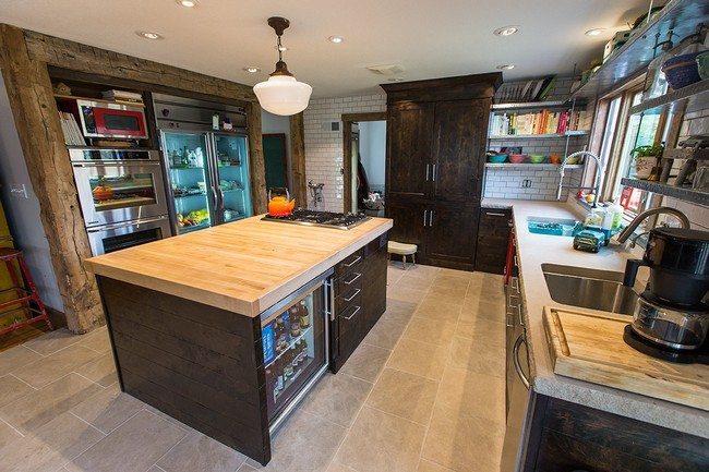Contemporary island design with cabinets and tiny in-built refrigerator with a glass door for storing drinks