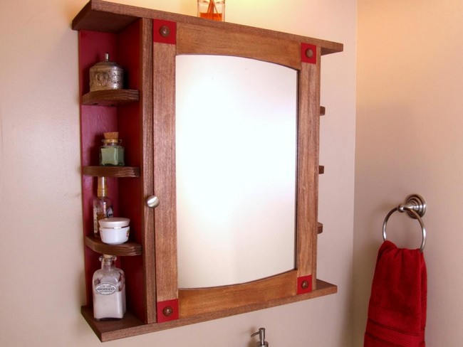 Mirror framed in wood acting as the cabinet door, with shelving on the side of the cabinet