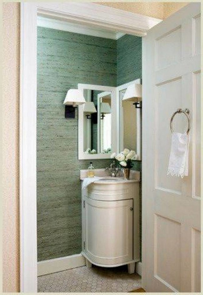 Twin bathroom mirrors above a small ivory island