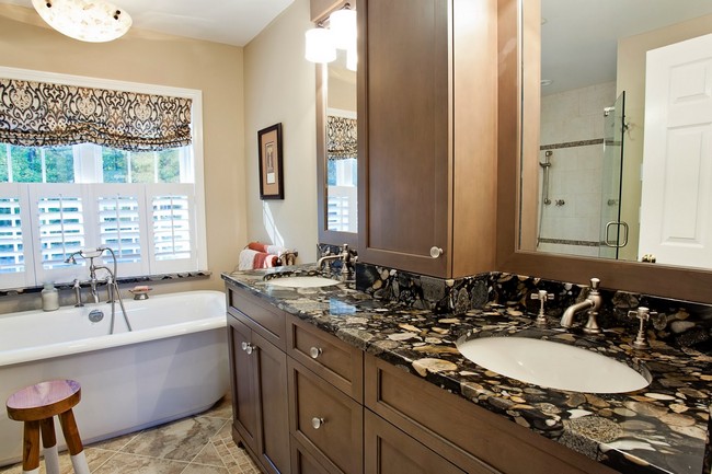 Marble countertop with dark and light patterns matching those of curtain