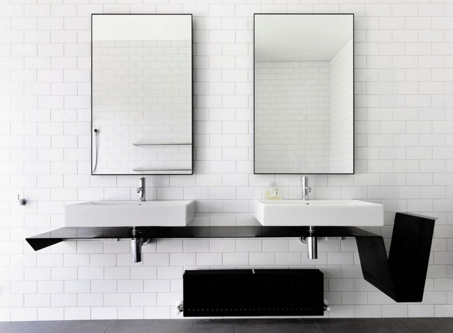 Twin mirrors placed on white subway tile