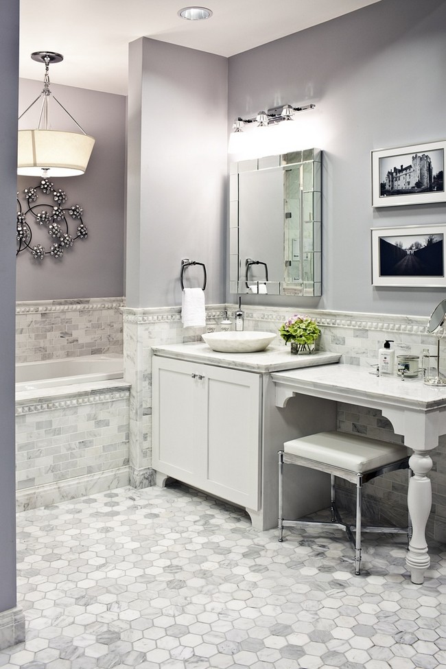 Elegant white marble bathroom with clear mirror on the wall