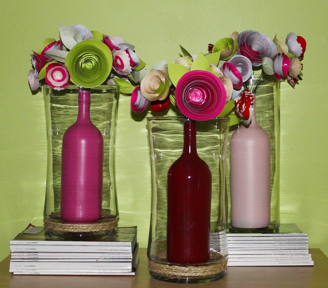 Bottles dipped in paint placed inside glass vase