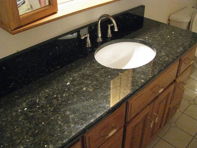Black marble countertop with round, in-built sink