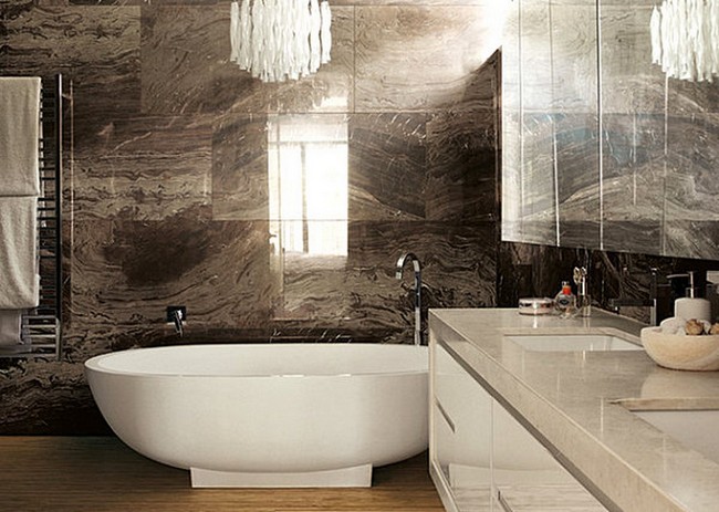  Warm and cozy bathroom with large, dark brown marble tiles