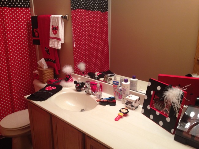 Colorful girls’ bathroom with red and black polka dot accents