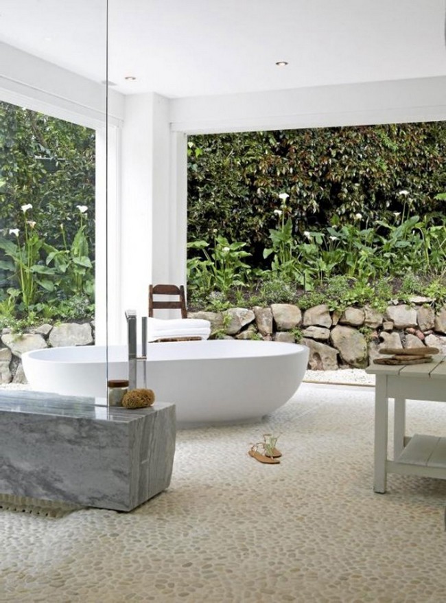 Spa-like outdoor bathroom with stone floor