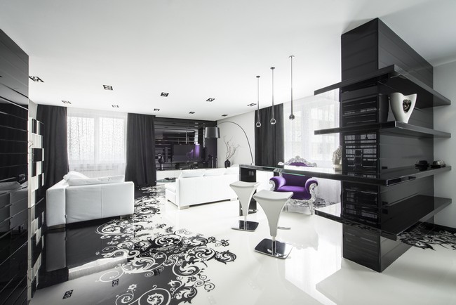 Simple black and white color palette with artistic imprint on the floor and in-ceiling lighting