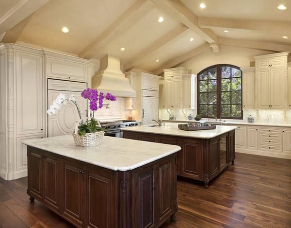 Two large islands with elegant cabinets that have exquisite trims and finishes