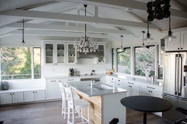Series of wooden beams across slanted ceiling help merge a rustic style with a contemporary style