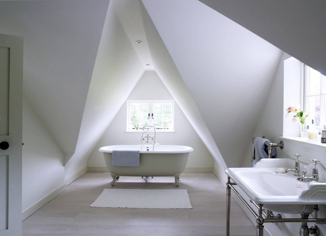 Bedroom with a white color scheme. The white color reflects the light, making the room appear airy and spacious.