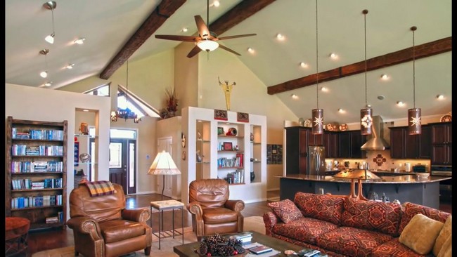 Slanted ceiling with wooden beams and pendant lighting
