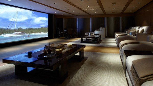Spacious home theater with recessed in-ceiling lighting and comfy sitting arrangements