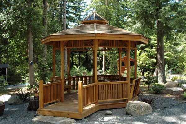 Small wooden gazebo with wooden terrace
