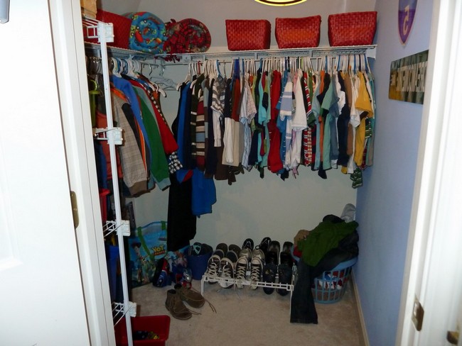 Medium-sized boy’s closet with a shelf and shoe rack